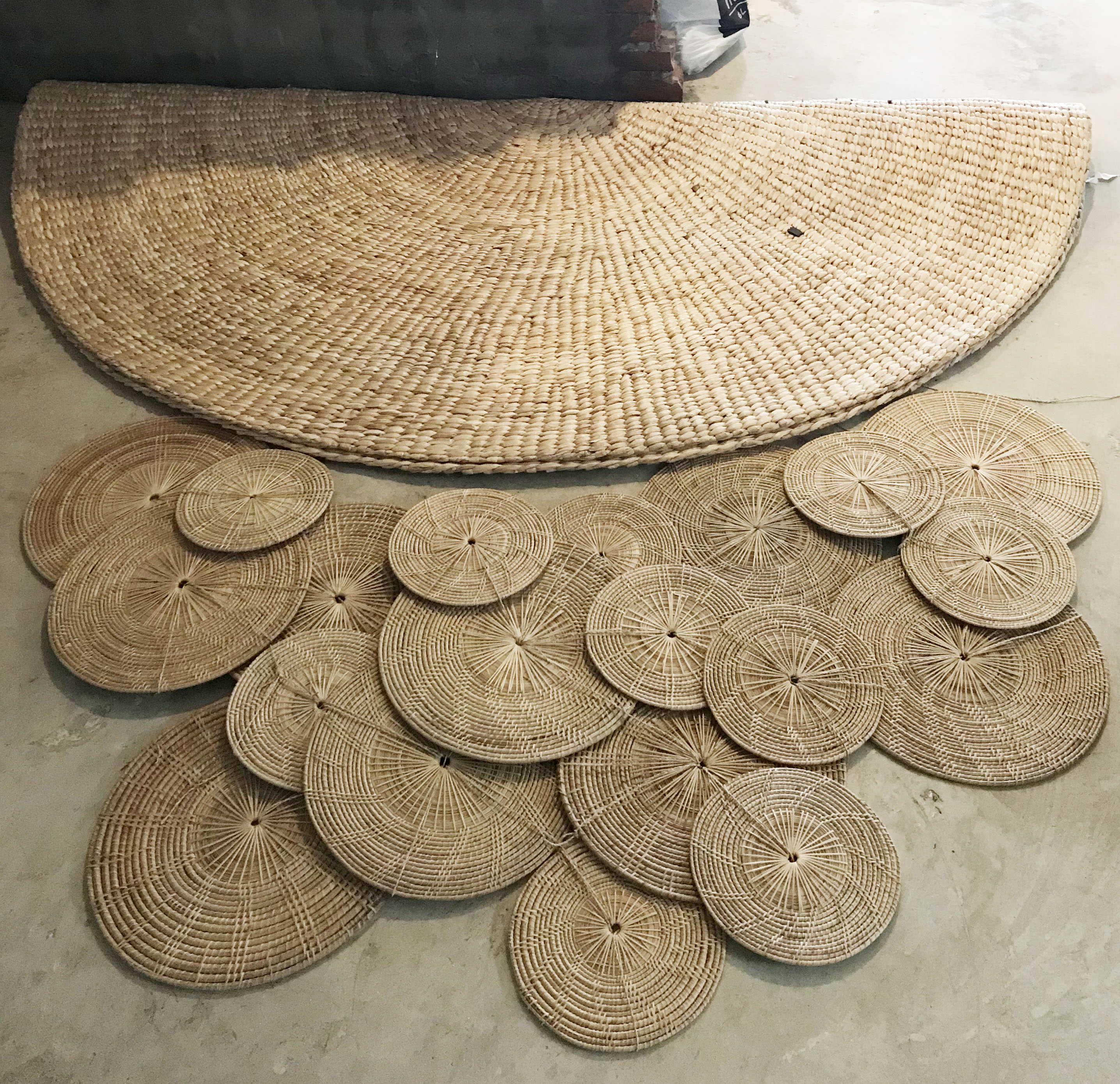 Woven rattan mats and rugs laid out as raw materials